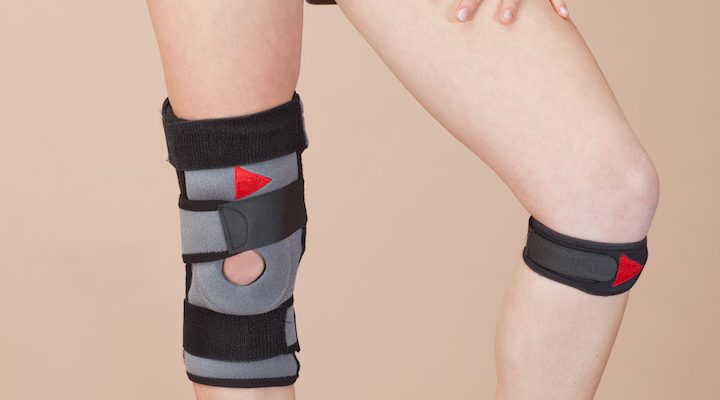 Young woman with various supports for sports injuries